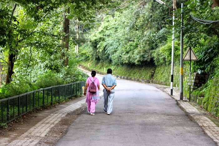 A couple takes a casual and romantic walk from Lower Mall to Kimmughat in Kasauli