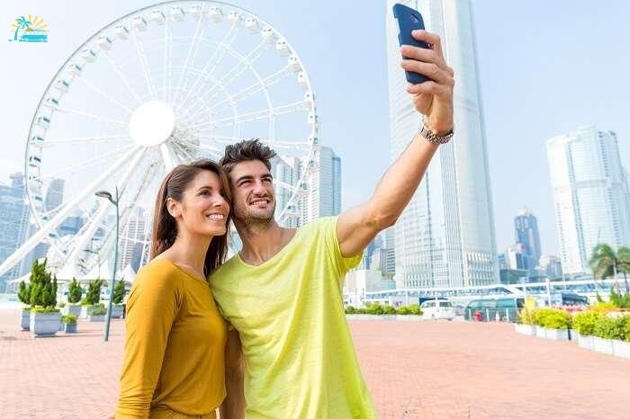A couple takes selfie on a honeymoon in Hong Kong