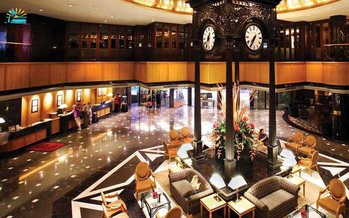 A gorgeous lounge area of a hotel with a huge clock