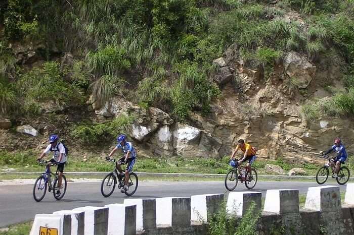 A group of people cycling in Chakrata
