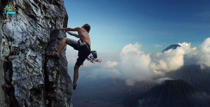 A man climbing a rocky mountain