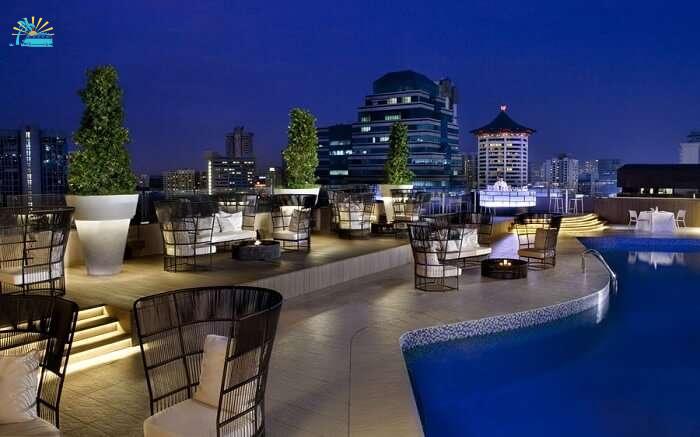 A terrace restaurant in a hotel with swimming pool