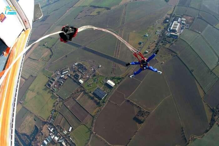 An adventurer going for static line skydiving in New Zealand
