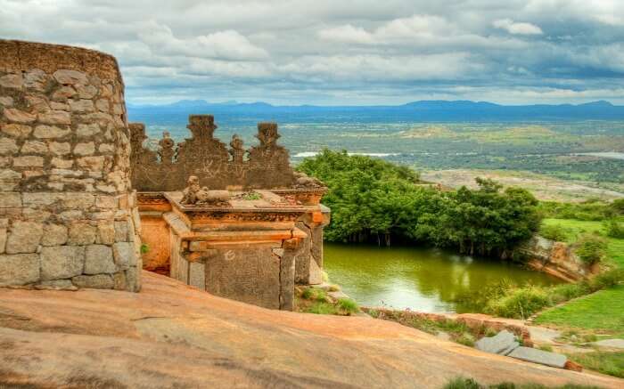Channarayana Durga Fort overlooking a lake and hills