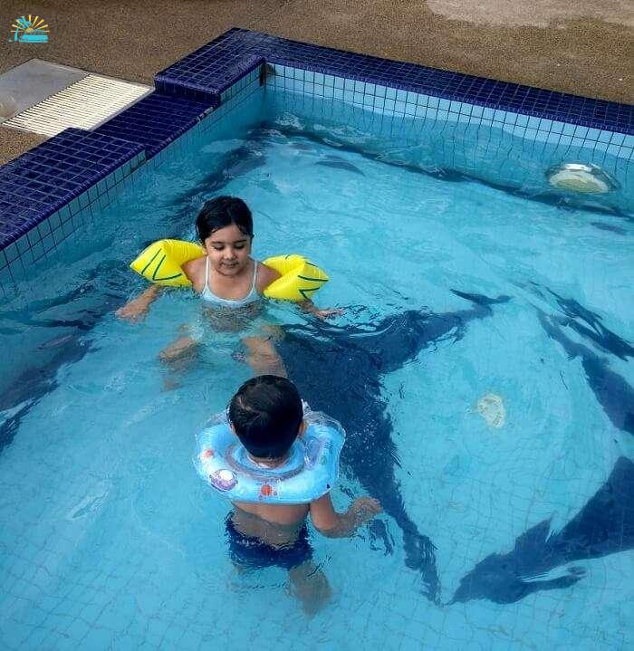 Children playing at hotel pool