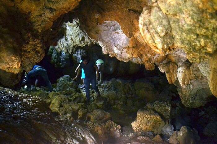 A tourist walks through the Mawsmai Caves in Meghalaya