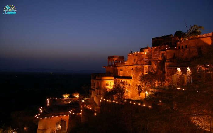 Neemrana Fort Palace lit up in evening