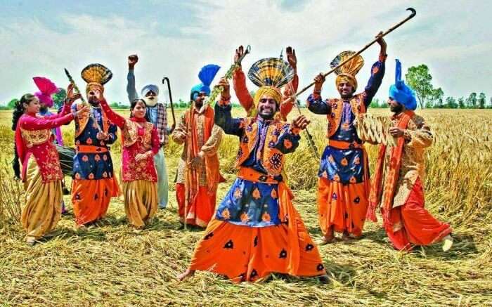 Punjabi men and women dancing during Baisakhi