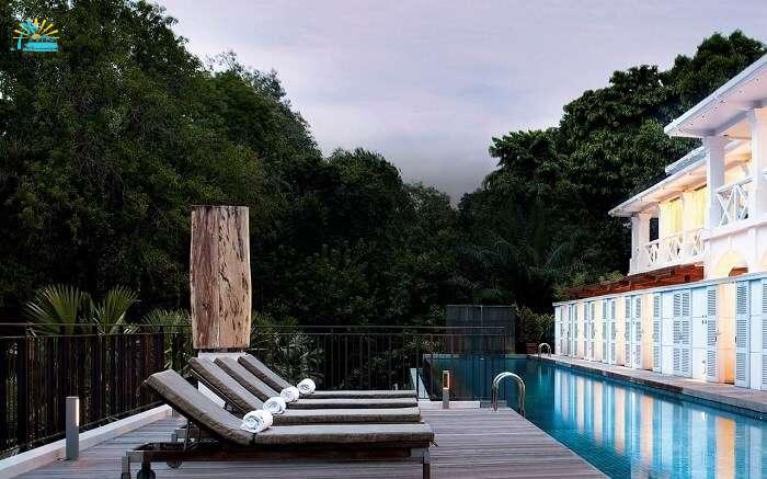 Sun decks near a swimming pool in a luxury hotel