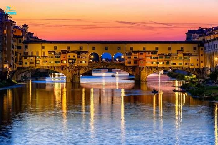 Sunset view of Ponte Vecchio over Arno River in Florence