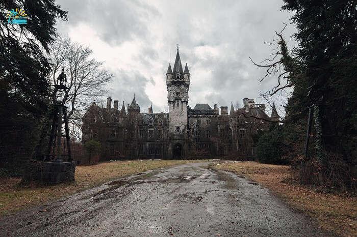 The abandoned and creepy Miranda Castle on a dark and gray day in fall