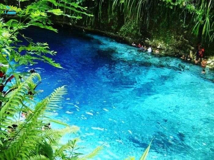 The clean blue waters of Enchanted River in Philippines