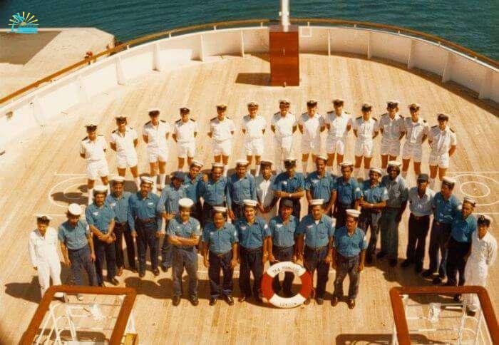 The cruise cabin crew gathers for a group photo before the sail of the ship