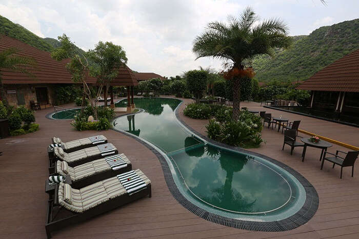 The swimming pool at Ananta Resort that offers a clear view of the Aravalli mountain range