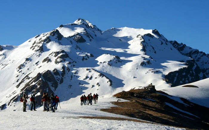 Trekkers on their way to Sar Pass in Himachal