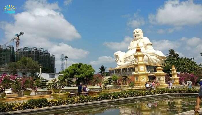 White Laughing Buddha statue in Vietnam