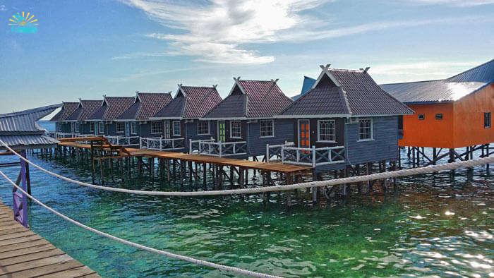 Wooden houses at BillaBong Scuba are built on spikes in the water