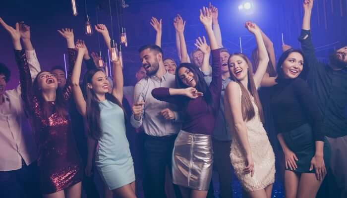 group of people dancing at a club