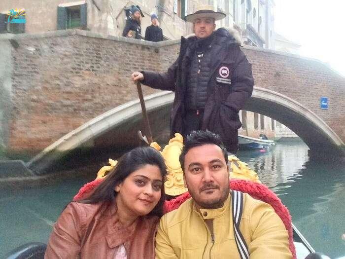 couple enjoying gondola ride in Venice